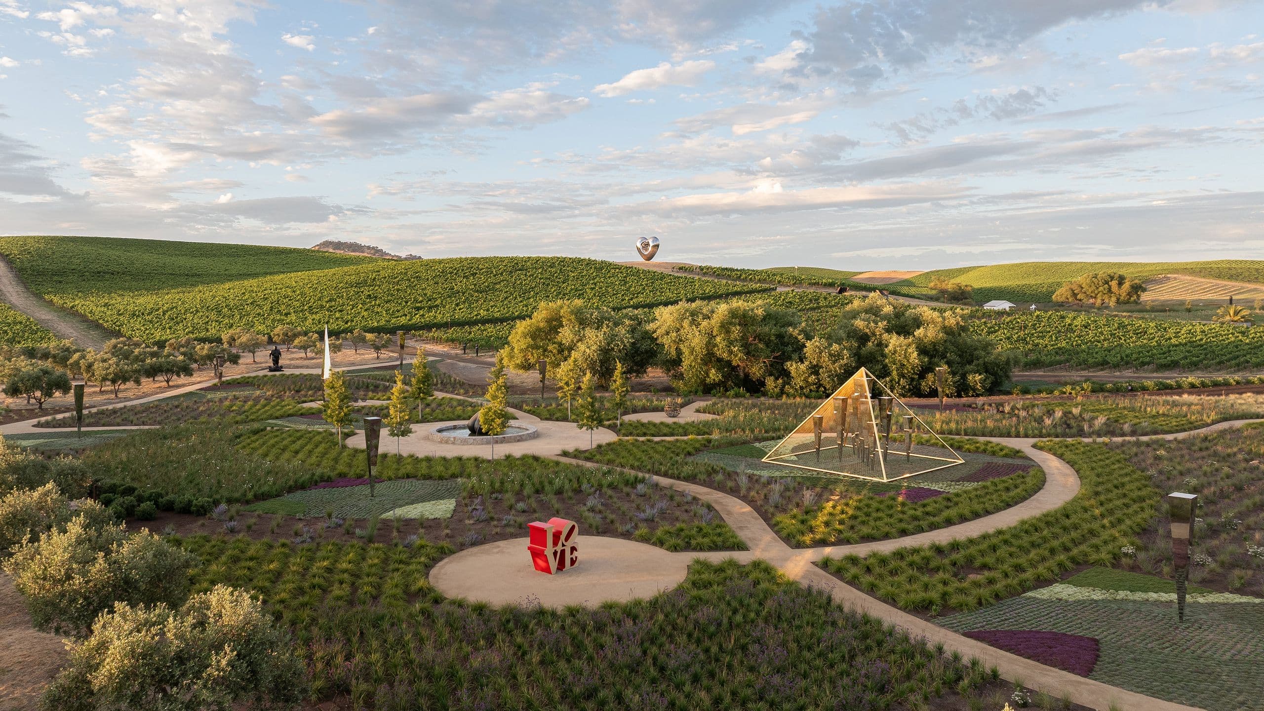 Rows of ornamental plants and trees arranged along a garden path